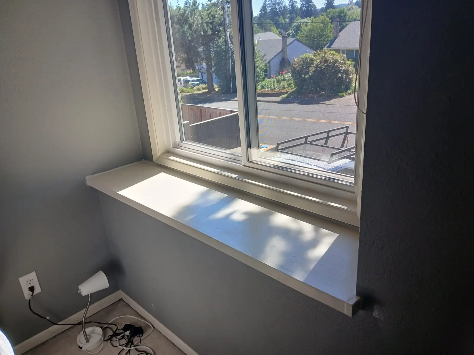 Deep painted window sill and casing on a bedroom window